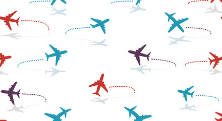 Seamless pattern of colorful airplanes flying with dotted trails on a white background.