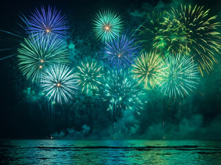 Vibrant teal and blue fireworks exploding over ocean; festive night sky celebration over water
