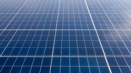 Close up view of a blue solar panel surface capturing sunlight for renewable energy.