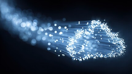 Cloud computing concept represented by glowing blue fiber optic cables forming a cloud shape