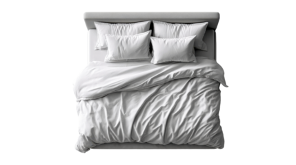 Comfortable and inviting bed with soft white linens and multiple pillows arranged for a restful nights sleep or morning relaxation