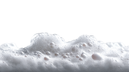 Close up view of white soap foam bubbles on a liquid surface providing a pristine textural background for cosmetic product presentations or daily hygiene product promotions