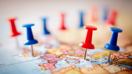 Colored map pins marking geographic points to represent location planning travel logistics and strategic global organization.
