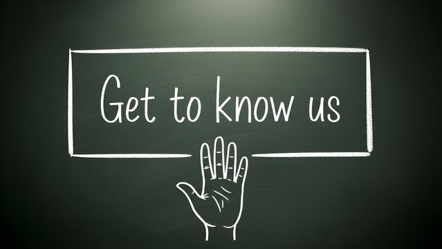 A hand pointing to a chalkboard with the words 'get to know us' written on it in white chalk