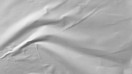 Glued paper texture. Crumpled and wrinkled surface of plain black paper poster background. Wrinkled...