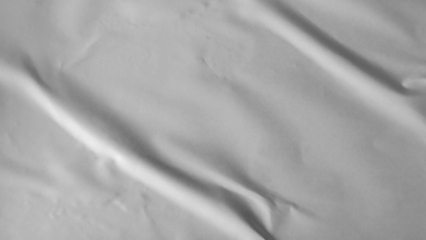 Glued paper texture. Crumpled and wrinkled surface of plain black paper poster background. Wrinkled wet paper