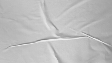 Glued paper texture. Crumpled and wrinkled surface of plain black paper poster background. Wrinkled...