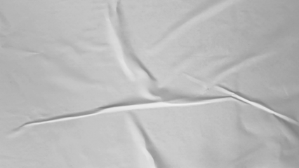 Glued paper texture. Crumpled and wrinkled surface of plain black paper poster background. Wrinkled wet paper