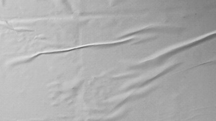 Glued paper texture. Crumpled and wrinkled surface of plain black paper poster background. Wrinkled...