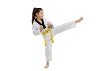 Confident Young Girl in Taekwondo Uniform with Yellow Belt Performing High Kick