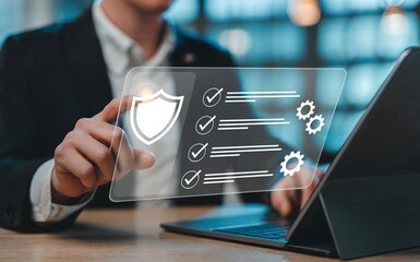 Businessman using digital interface with checklist and security icons image