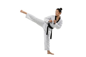 Female Martial Artist Performing High Kick in White Uniform