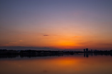 Obraz premium Sunset Glow With Colorful Clouds Over Calm Horizon