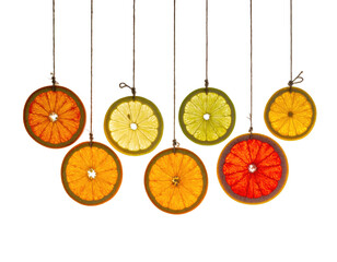 Citrus slices hanging, bright translucent detail, dark ground
