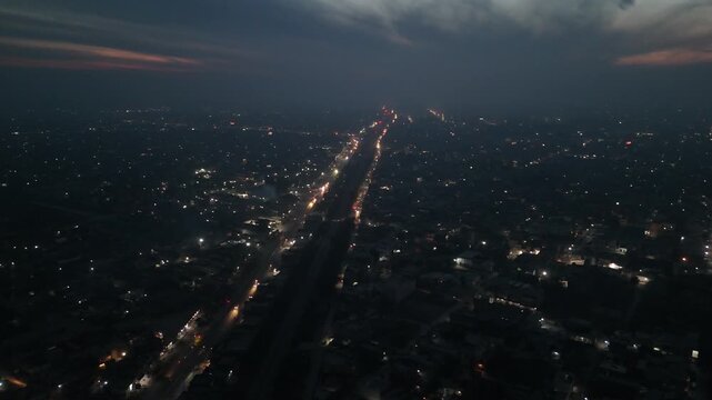 Night City View of Okara Punjab Pakistan Drone Ariel shot 4k Transportation scenery. Business office buildings. Night view Camera is flying above the city