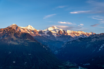 A beautiful view of the Swiss Alpine landscape near Interlaken. Alpine glaciers in the sunset light.