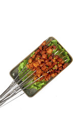 Hot Spicy Yakitori Skewers on Plate with Lettuce