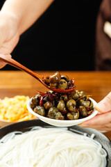 Spicy Guangxi Snail Noodle Dish - Traditional Chinese Cuisine