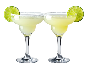 Two refreshing margaritas with salted rims and lime wedges