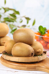 Fresh Yellow-Hearted Kiwis in Bamboo Basket Still Life