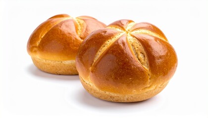 Two round bread rolls with glossy golden-brown crust, patterned with five curved slits radiating like a flower.