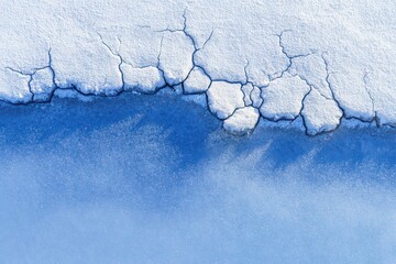 Abstract Close Up of Textured White and Blue Surface with Crack Patterns and Glittering Effect Under Bright Lighting