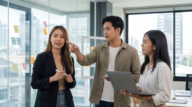 A creative team collaborates on ideas with sticky notes in a modern office. - Powered by Adobe