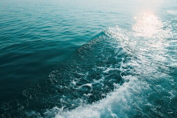Aqua Ocean Water Texture with Sunlight Reflection Creating Wave Patterns and White Foam in Motion on a Sunny Day Showing Natural Beauty