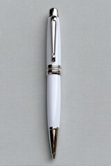 Elegant White Pen with Silver Accents on Textured Gray Background, Close Up Detail, Silver Clip and Fine Nib, Minimalist Composition, Office Stationary