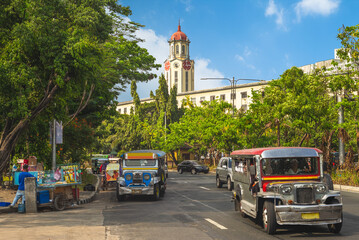 street view of manila with jeepney and clock tower © Richie Chan