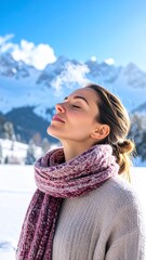 Young woman enjoying fresh air and sunshine in a snowy mountain landscape.