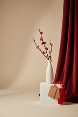 White vase with red blossoms and shopping gift boxes symbolizing modern Chinese New Year decor