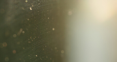 Closeup of dirty glass with sunsey light