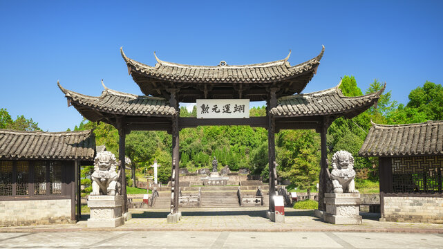 Historic Chinese Gate with Upturned Eaves and Lion Statues