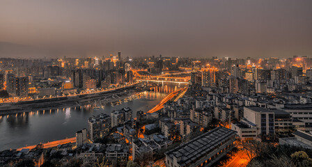 Obraz premium Chongqing Night Bridge View - Yangtze River Cityscape with Golden Lights