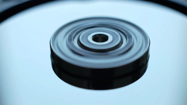 Close-up of spinning hard drive disk technology concept with motion blur.