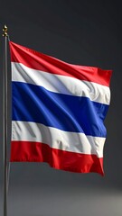 Vibrant Thai Flag Waving Proudly Against a Dark Sky, Symbolizing National Identity and Patriotism.