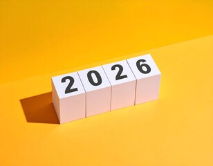 White blocks with black numbers "2026" on a bright yellow background