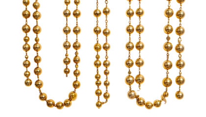 Several strands of hanging, gold-colored beads on a black background