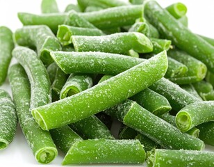 Close-up of frozen, cut green beans with a light dusting of frost