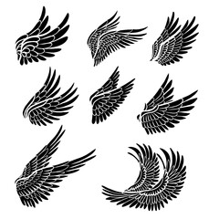 Vector set of black monochrome bird wings. Collection of monochrome angel clip arts wings isolated of the background.