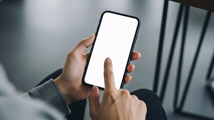 Person holding a smartphone with a blank white screen