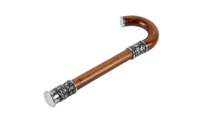 Elegant curved wooden cane with silver accents, isolated on black