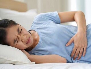 Woman Experiencing Pain While Lying in Bed