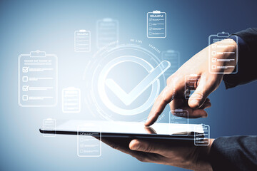 Digital checkmark interface with user hand tapping tablet screen surrounded by floating approved checklist icons on light blue background.