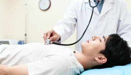 Medical examination of patient with stethoscope hospital room healthcare scene indoor setting close-up perspective patient care concept