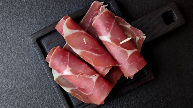 Meat, ham, jamon, or prosciutto sliced for breakfast bruschetta. Sliced ham, jamon, or prosciutto