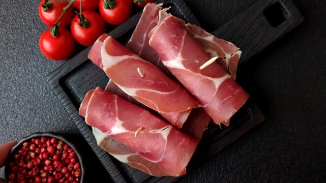 Meat, ham, jamon, or prosciutto sliced for breakfast bruschetta. Sliced ham, jamon, or prosciutto