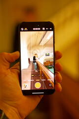 Staircase scene mood, Individual photographed on warm staircase, Candid shot of person on glowing stairs, Warmly lit staircase with candid person capturing cinematic feel