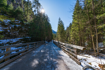 Icy path at Dolina Koscieliska valley in snow at beautiful Polish west Tatry mountains in winter
